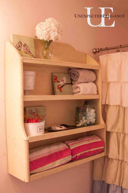 Old Cabinet about toliet in bathroom via Unexpected Elegance