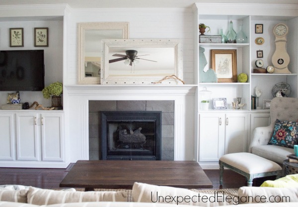 See how to transform you your living room with DIY fireplace built-ins! It completely changed the look of the space and made it feel bigger.