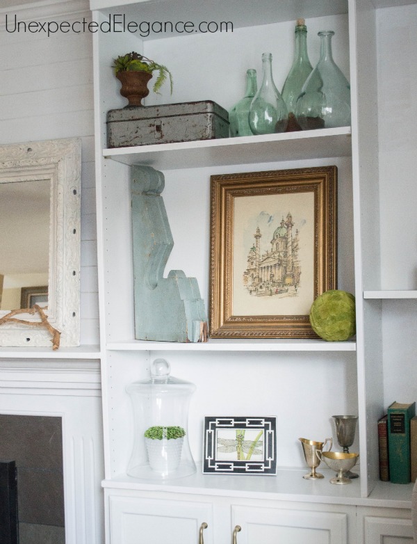 See how to transform you your living room with DIY fireplace built-ins! It completely changed the look of the space and made it feel bigger.