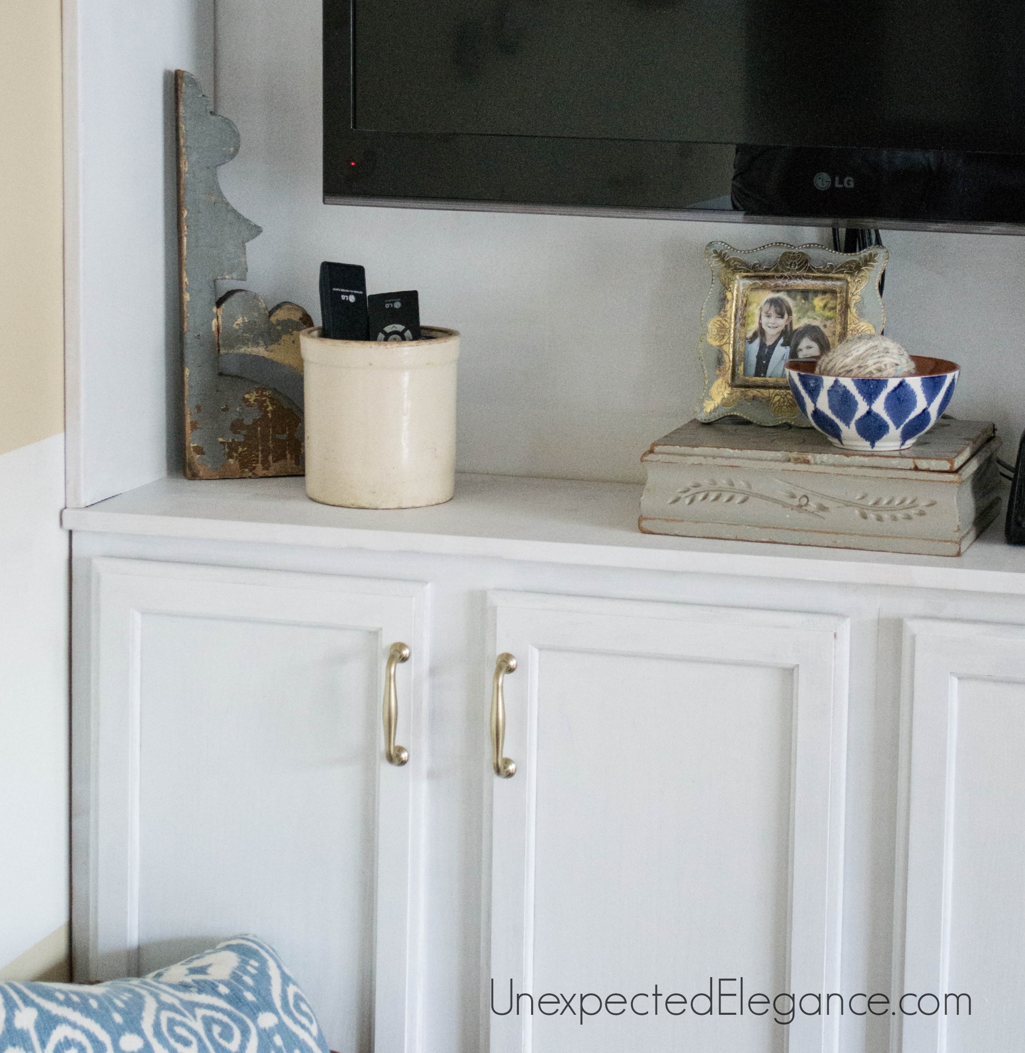 See how to transform you your living room with DIY fireplace built-ins! It completely changed the look of the space and made it feel bigger.