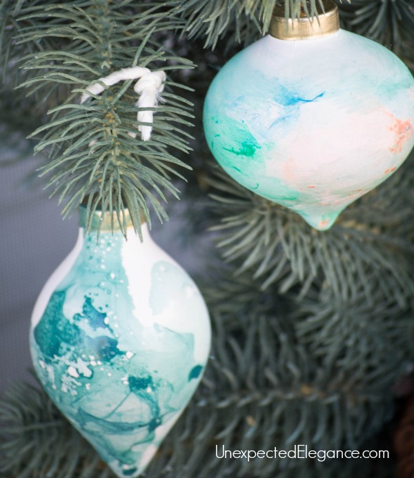 DIY Watercolor Ornaments Using Nail Polish.  These take a minute to make and is a lot of fun for the kids!