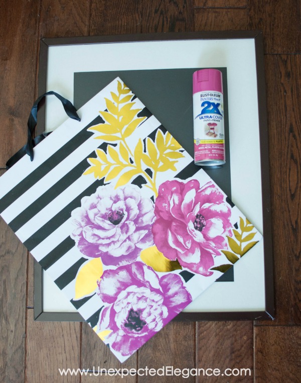 Artwork can be so expensive, especially larger pieces...but there is always a way to get around it.  You can make your own from a large piece of scrap wood, architectural salvage or GIFT BAGS!  Find out how to make easy DIY gift bag art!!
