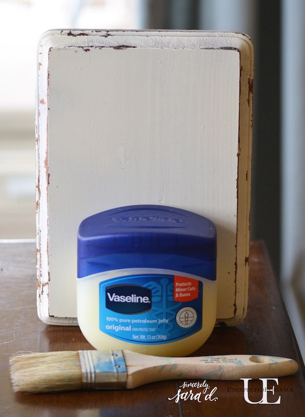Want to easily distress a piece a piece of furniture?! Try this awesome and EASY technique using Vaseline. 