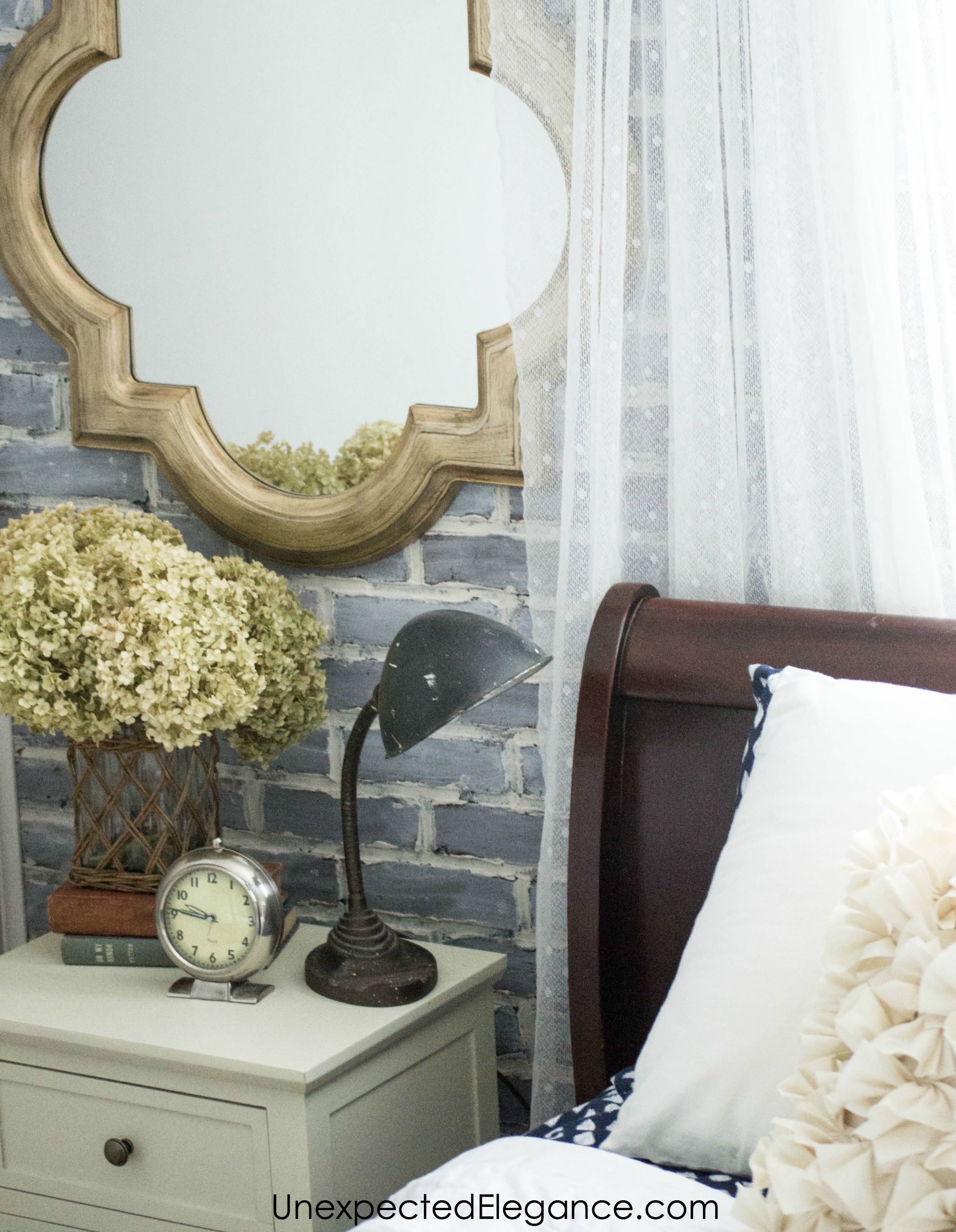 Check out this loft-inspired makeover! A few economical changes to a guest bedroom completely changed the feel.