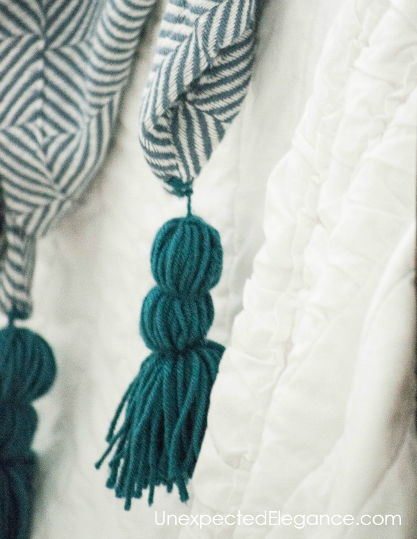 Do you love pom-poms and tassels??  See how easy it is to add them to blankets!!