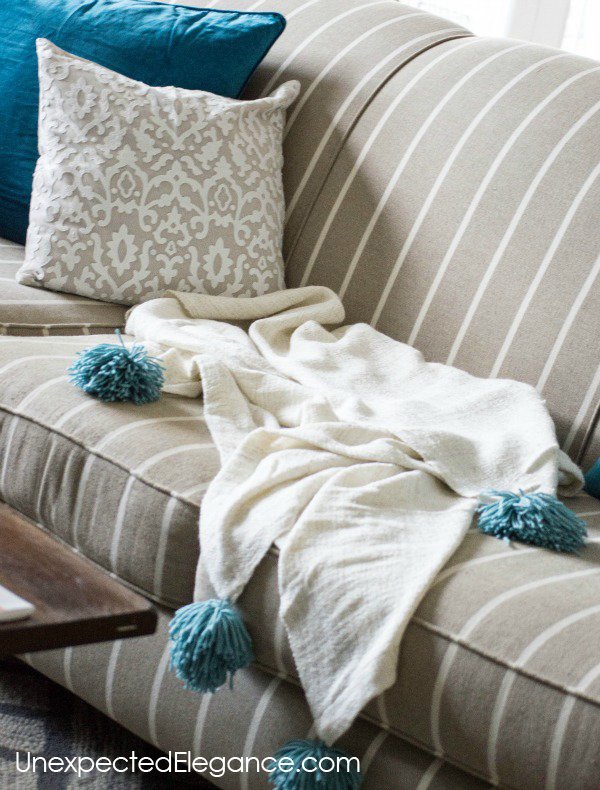 Do you love pom-poms and tassels??  See how easy it is to add them to blankets!!