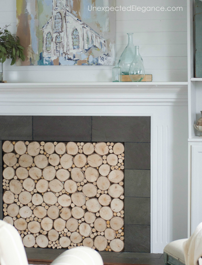 Want to add interest to your fireplace? Get a quick and easy tutorial for creating a faux stacked log insert! It's also a great way to keep out drafts.
