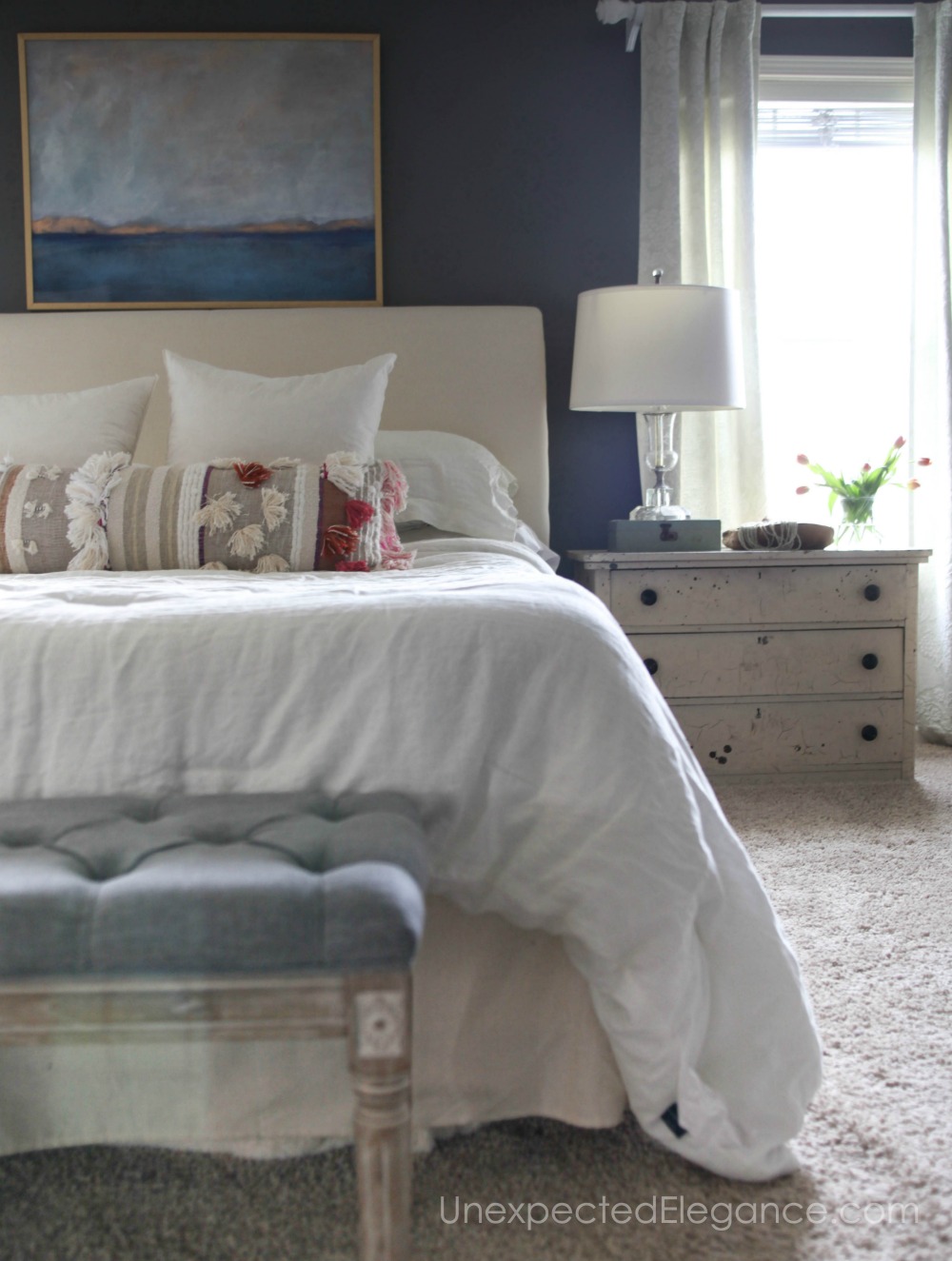 Check out this master bedroom refresh! By using things you already have and cleaning out the clutter, you can have a new space without spending any money!