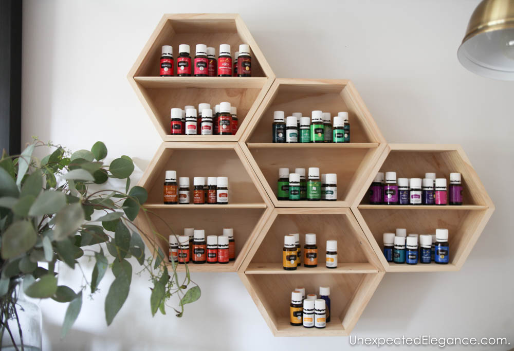 Need a pretty way to keep track of all your oils? Make this EASY DIY essential oil storage unit.