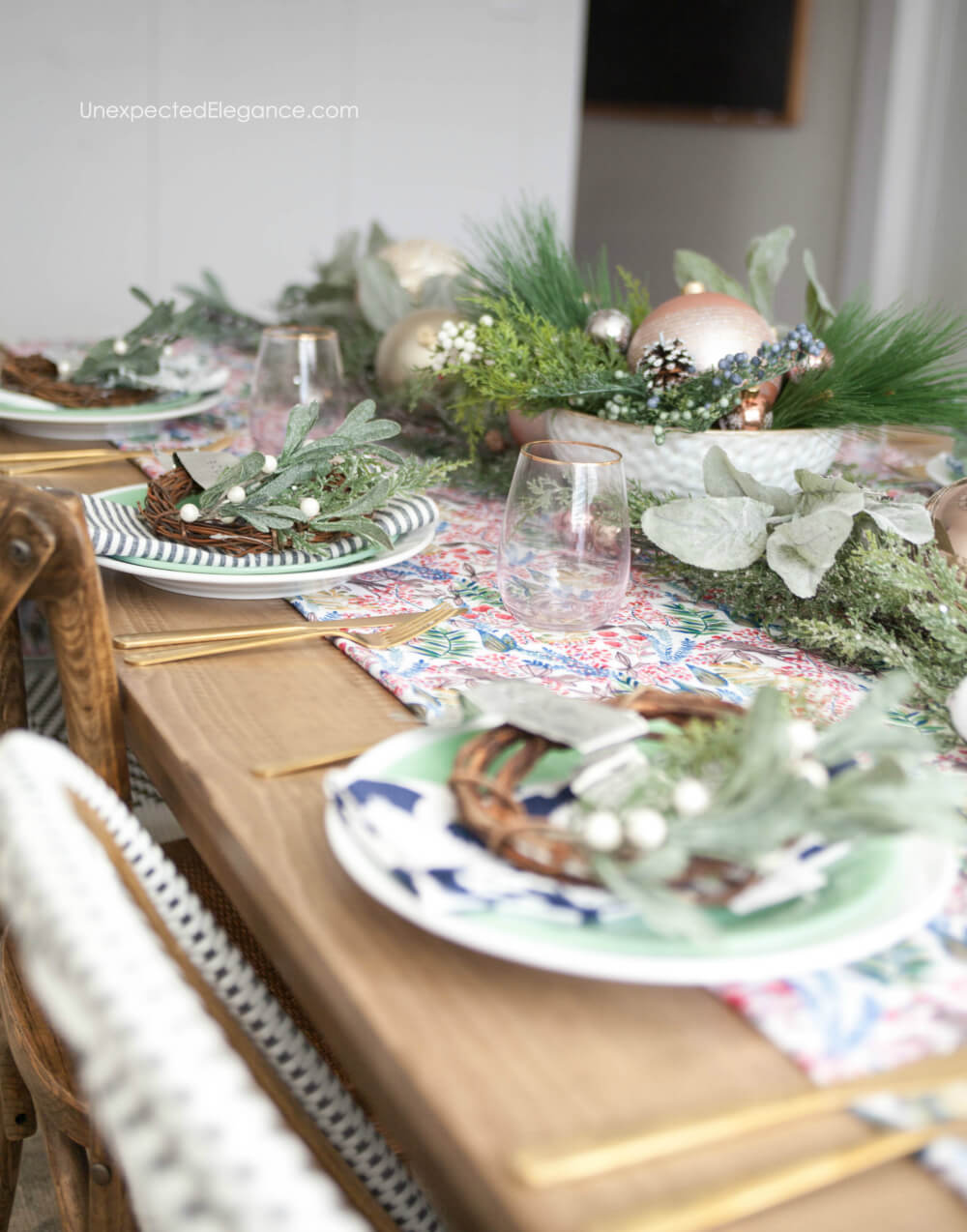 Here's a fun and festive holiday tablescape that super easy to put together.  Check out the non-traditional colors and get tutorial for a mini wreath your guests can take home.