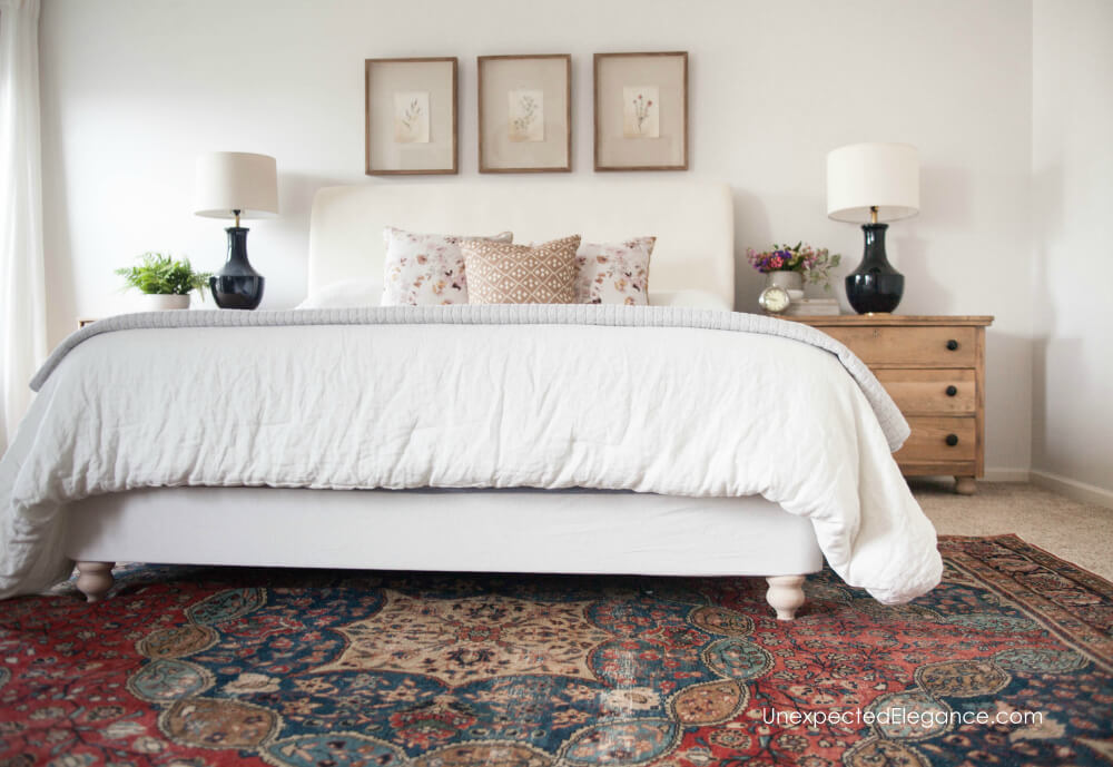 This super simple DIY bed frame reupholstery transformed the look of this bed.